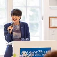 President Mantella standing at podium, speaking into microphone and addressing crowd